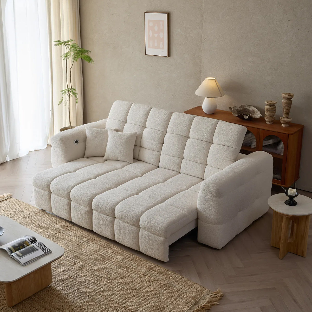 Lennon Bouclé Sofa Bed partially extended, showing the pull-out mechanism and deep tufting clearly.