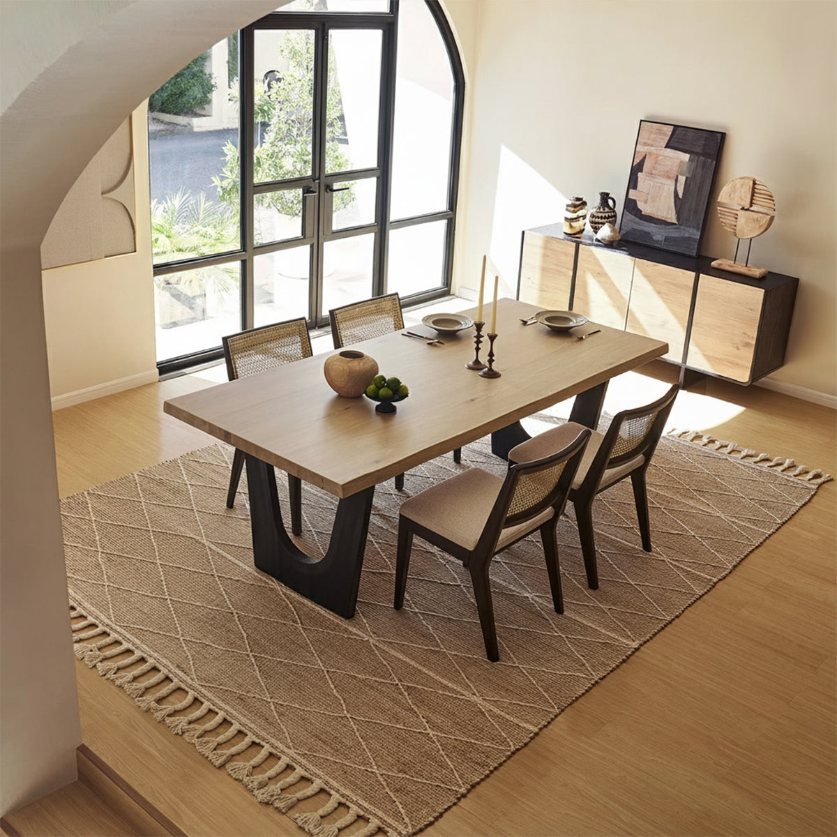 Lumea 4-seater solid wood dining table with cane chairs in a modern dining room setup