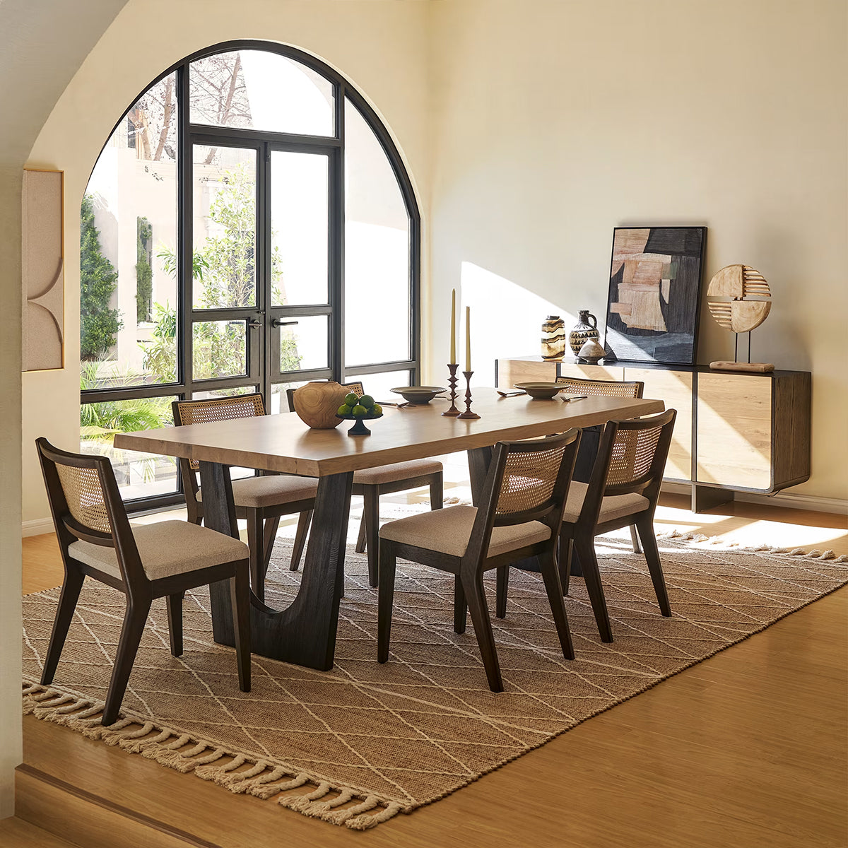 Lumea 6-seater solid wood dining set with cane chairs in a bright contemporary dining space