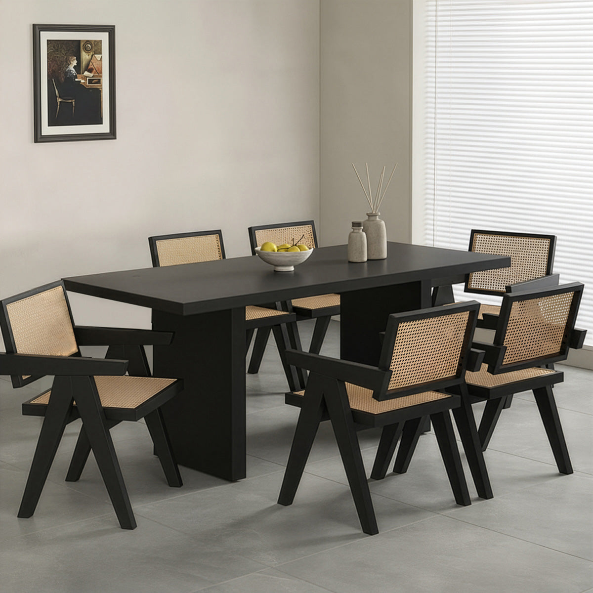 Elegant black wooden dining table surrounded by six natural cane and black frame chairs, suitable for family gatherings.