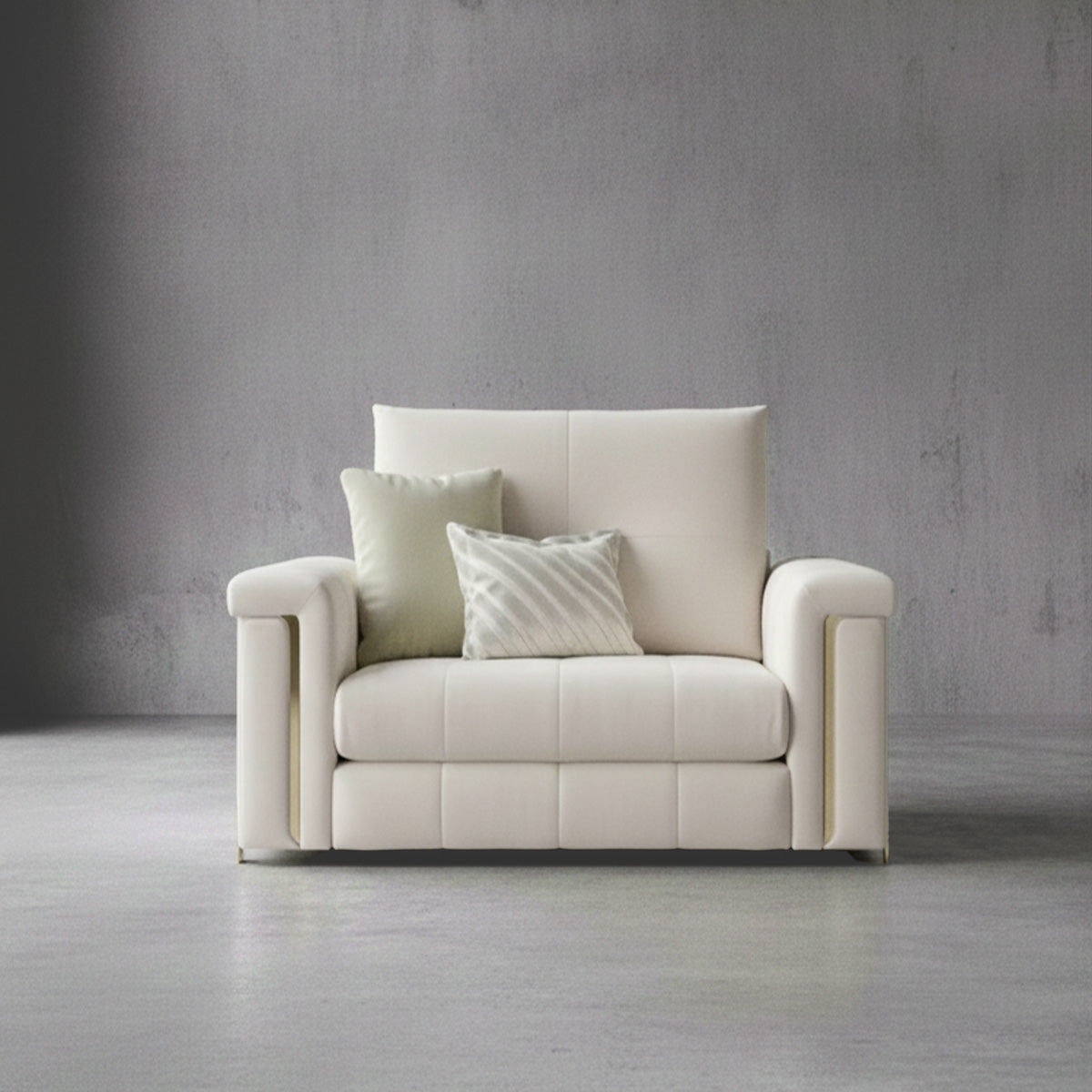 Alcotta luxury single-seater armchair in cream with gold metal vertical accents on wide armrests.