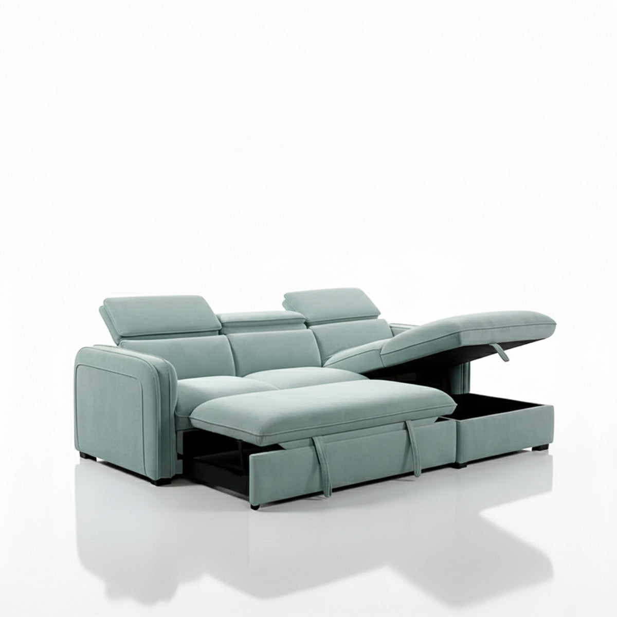 A 3/4 angled view of the light-blue sectional sofa demonstrating its storage and sleeper features. The sleeper portion is partially pulled out, and the seat of the chaise is propped open to reveal a hidden storage compartment inside the base.