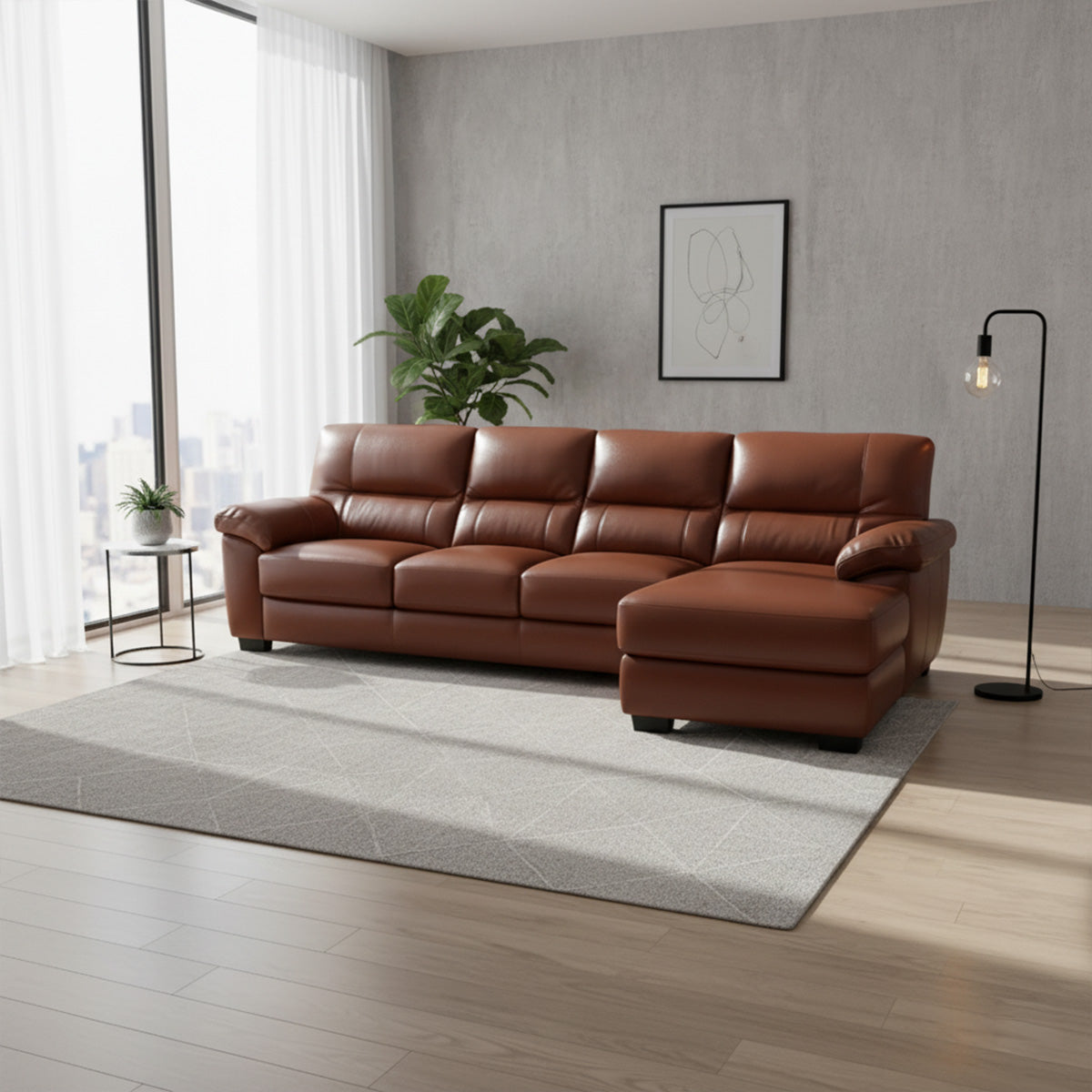 A modern living room features a brown leather 3-seater sofa with a left-hand side (LHS) chaise lounge, set on a grey rug. Large windows provide natural light, and the decor is minimal with a potted plant and a floor lamp.