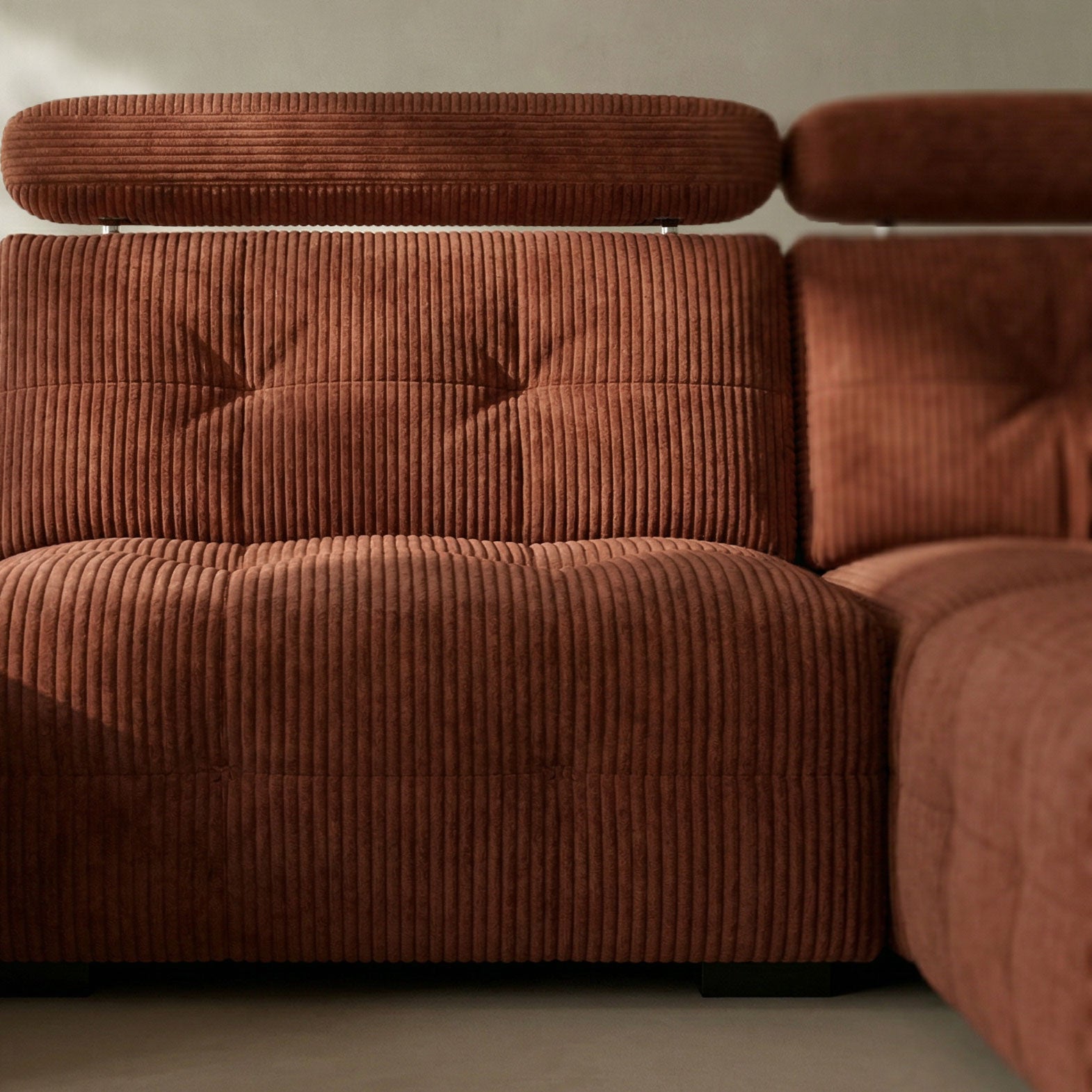 Brown corduroy sofa with a neutral background