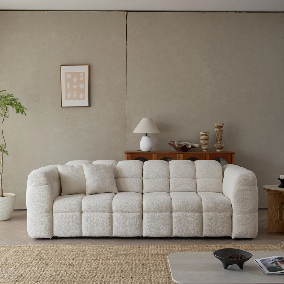 Front view of the Lennon Cloud Bouclé Sofa, highlighting the modern design, rounded arms, and square tufting.