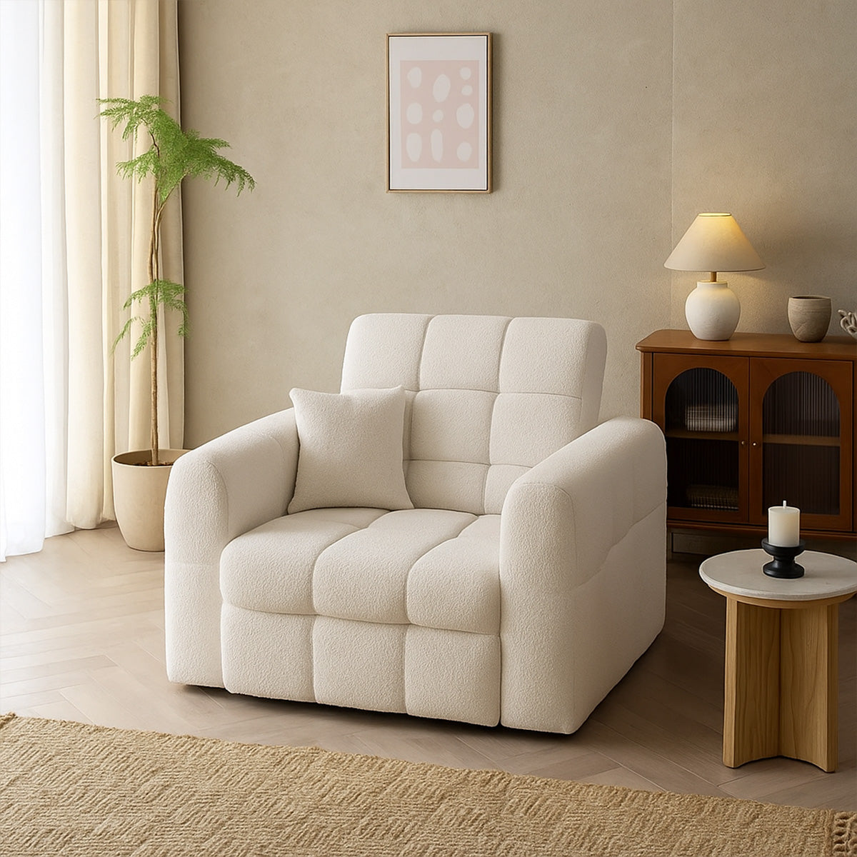 Klara white bouclé or sherpa armchair with a quilted, tufted texture, placed in a bright, neutral-toned living room with a houseplant and modern table lamp.