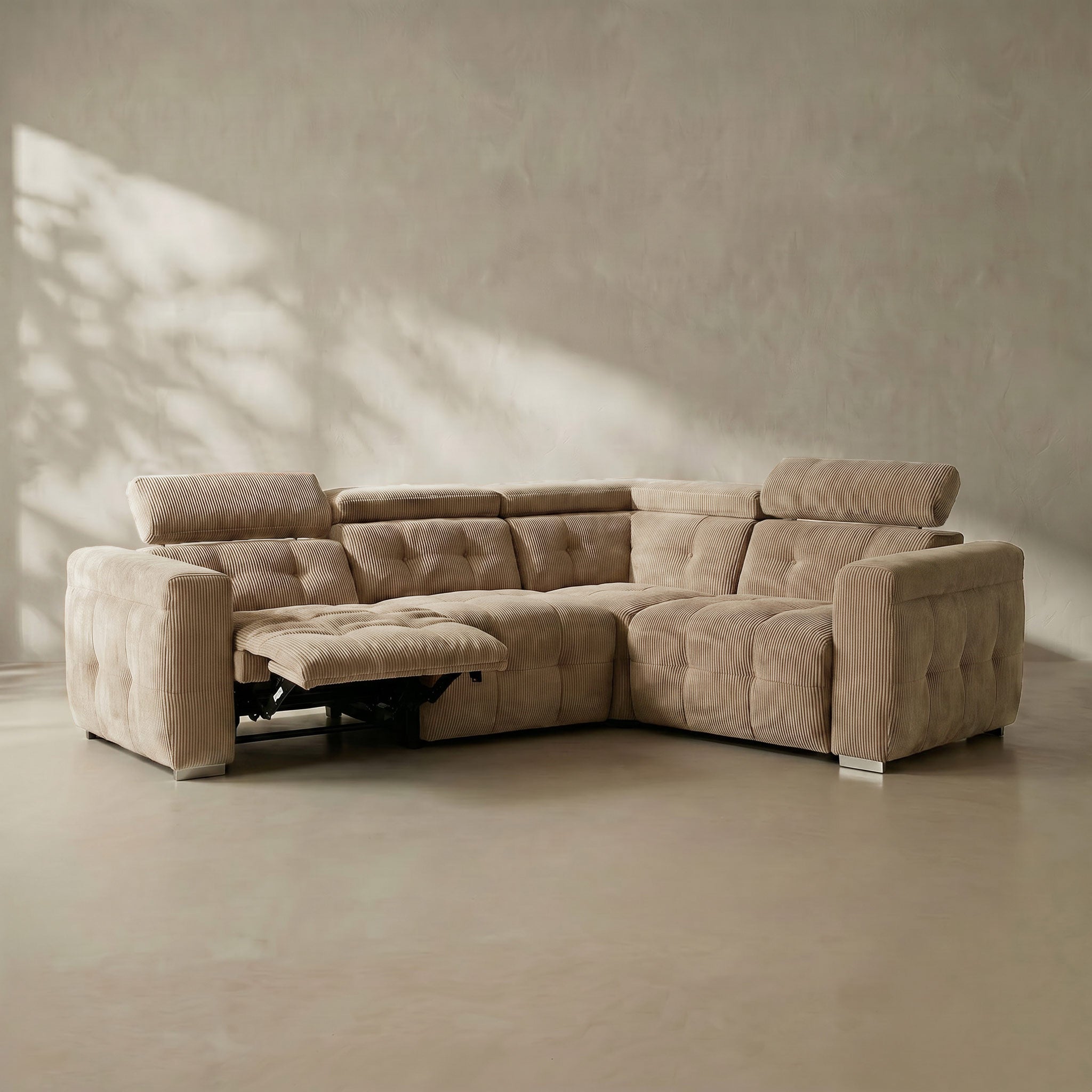 Beige sectional sofa in a minimalistic room with soft lighting