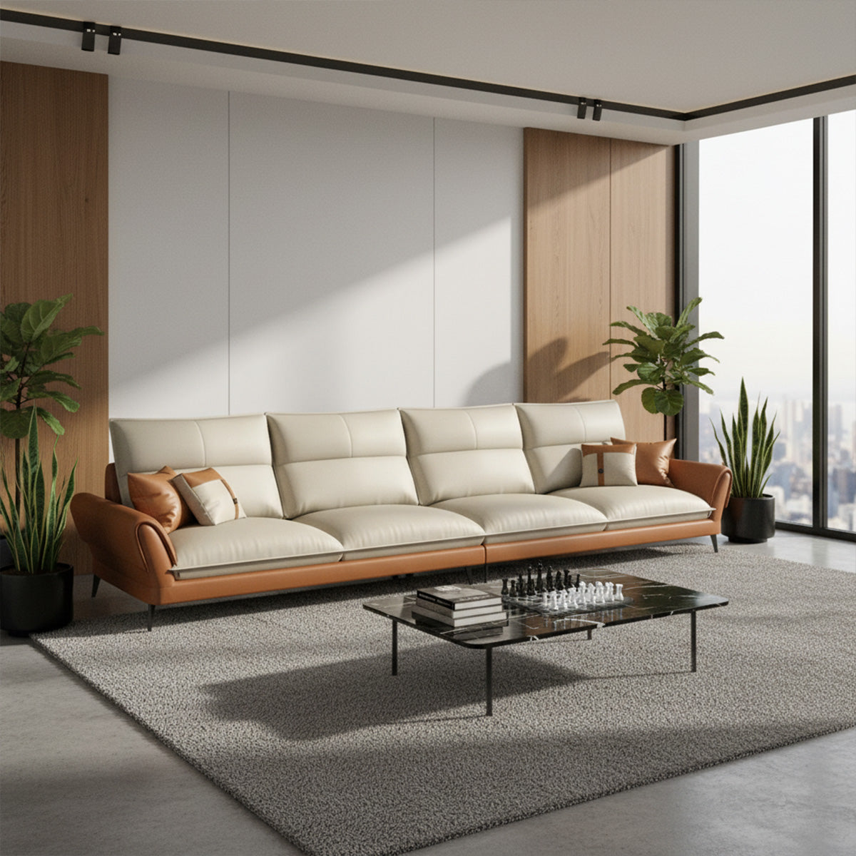 An extra-long, four-seater NOVA sofa with a cream seat and back, featuring tan leather rolled arms and base. It is positioned in a bright, minimalist room with floor-to-ceiling windows and wood accent panels. A black marble-top coffee table with a chess set sits on a large gray area rug.