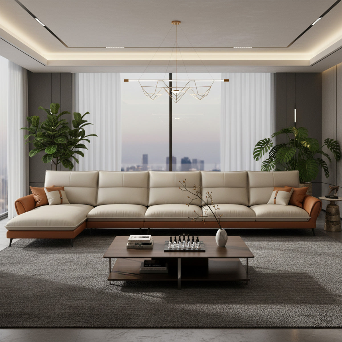 A large NOVA sectional sofa with a three-seater section and a left-hand facing chaise lounge (LHS). The sofa features two-tone upholstery: cream seating and tan leather arms/base. It is set in a light room with a white textured wall, a dark wood coffee table with a chess set, and various potted plants.