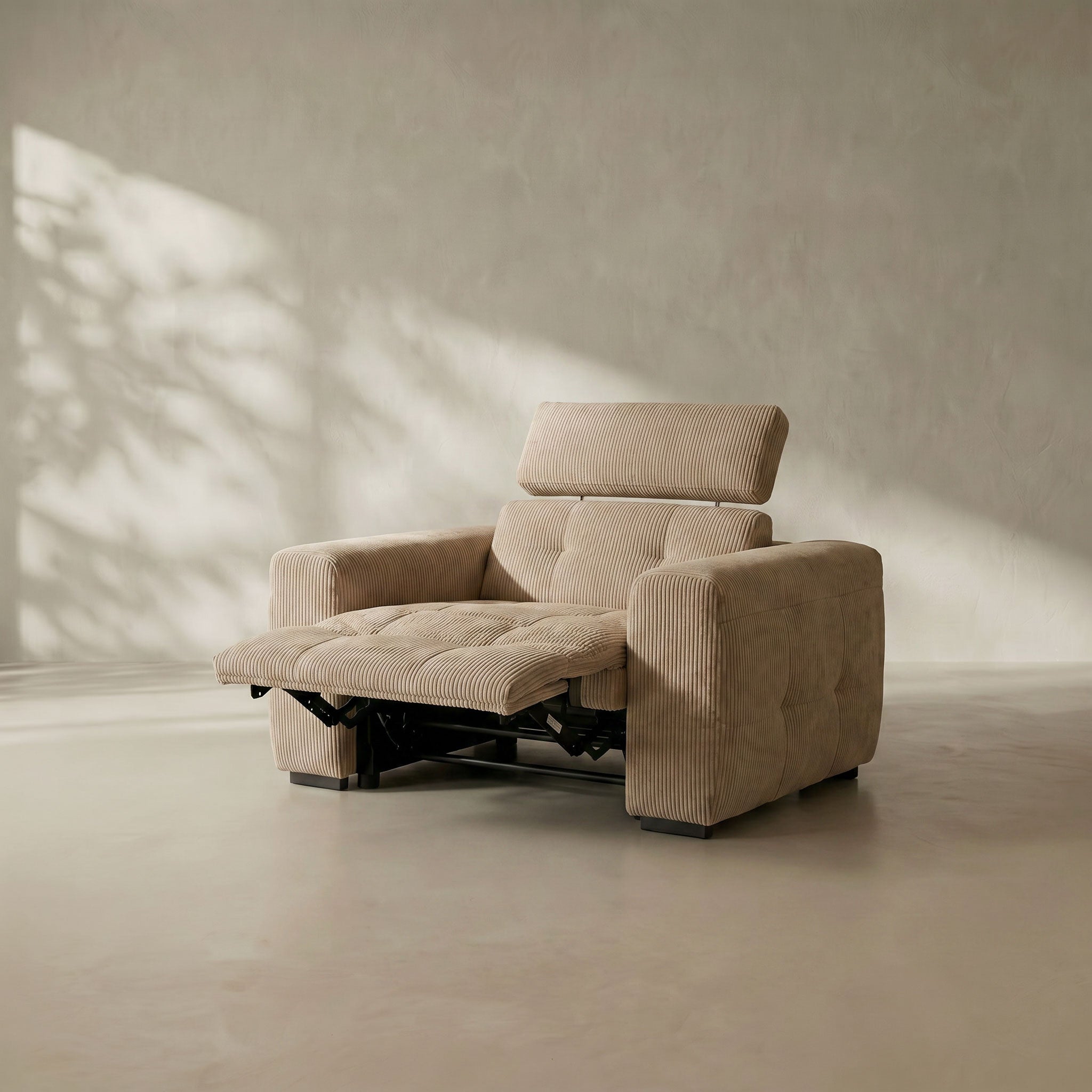 Beige recliner chair in a minimalistic room with soft lighting